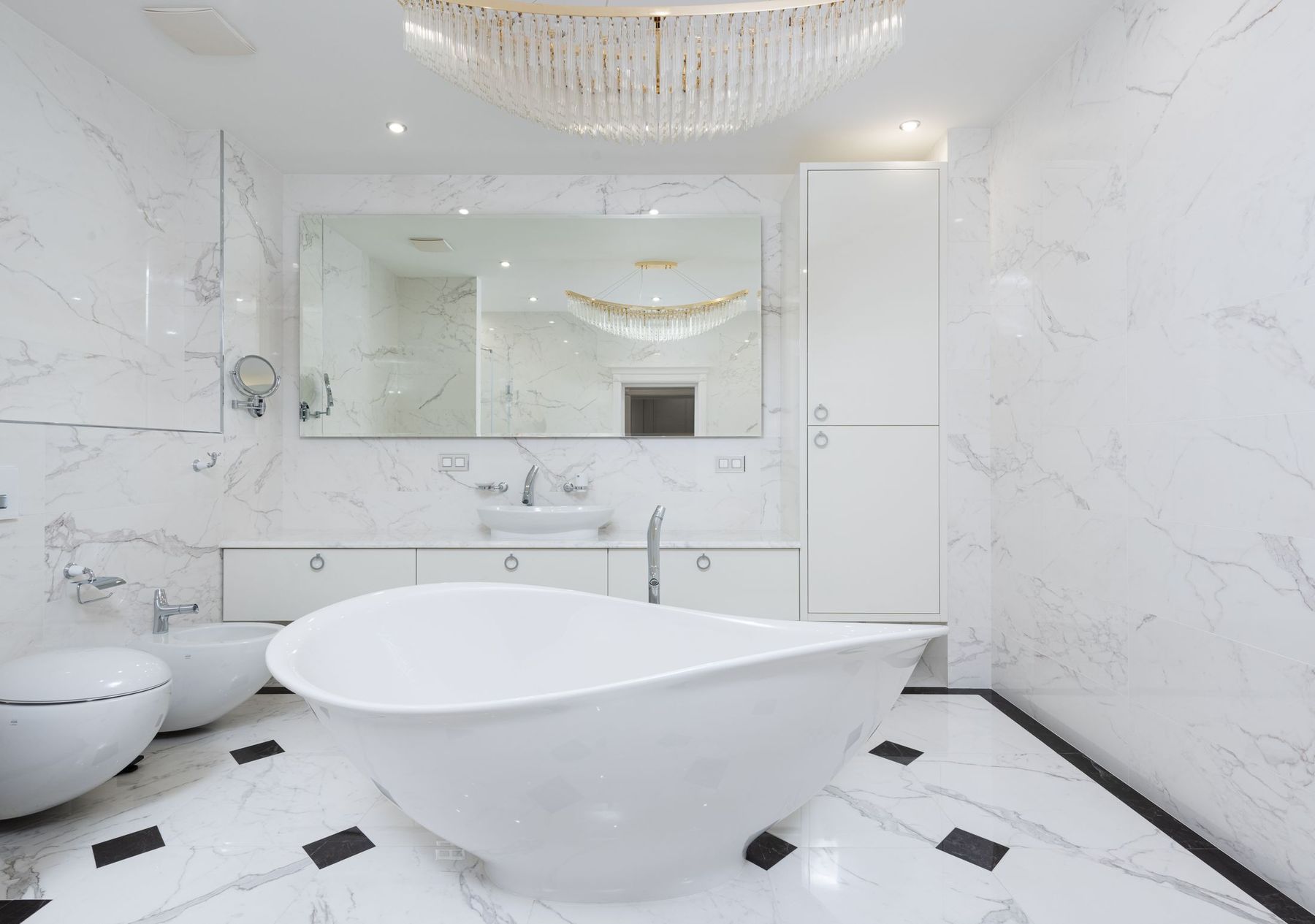 Primary bath remodel with marble and a freestanding tub