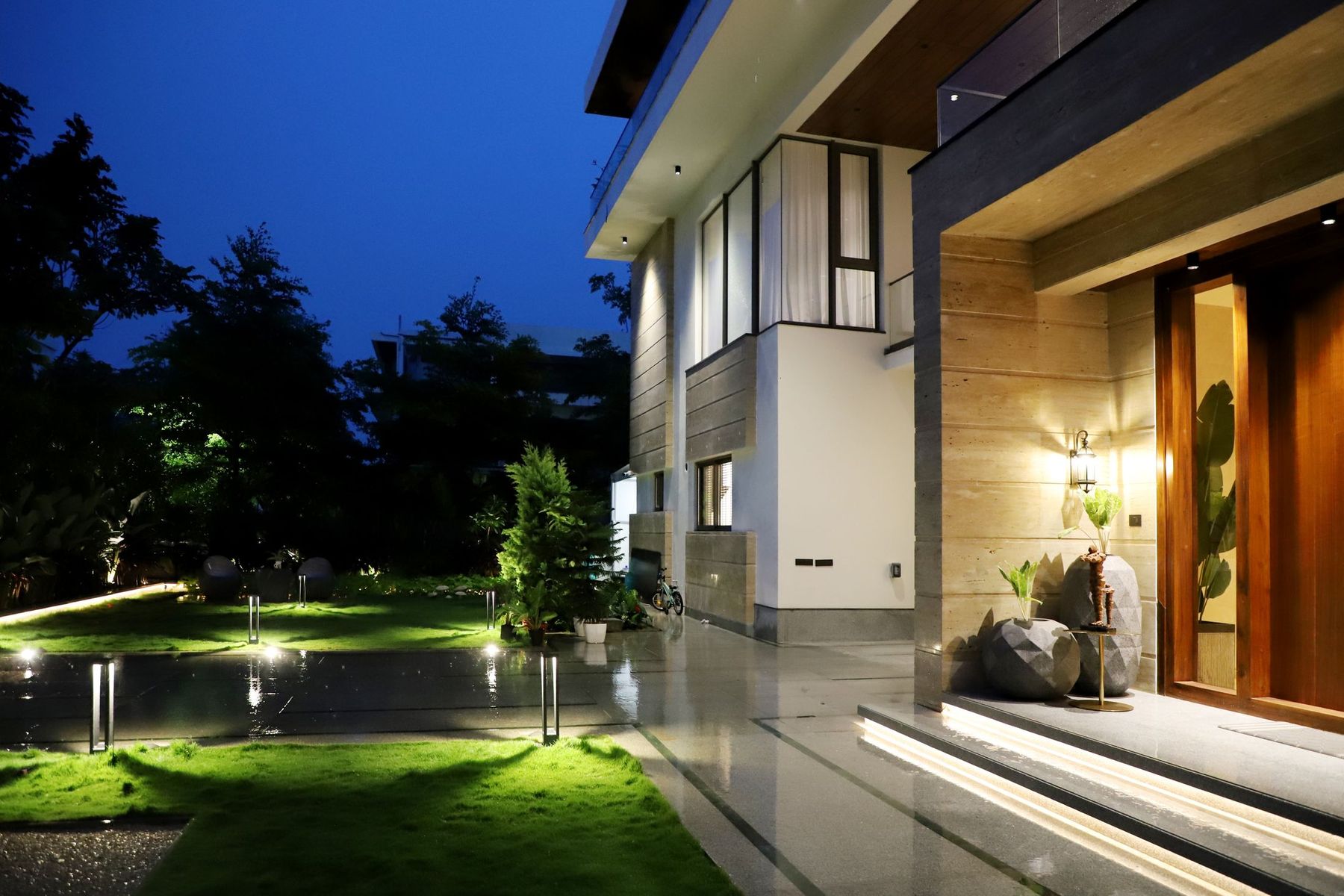 A home glowing with warm light at dusk