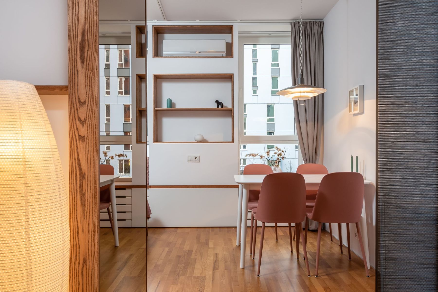 A warm, sunlit living and dining space with wood tones